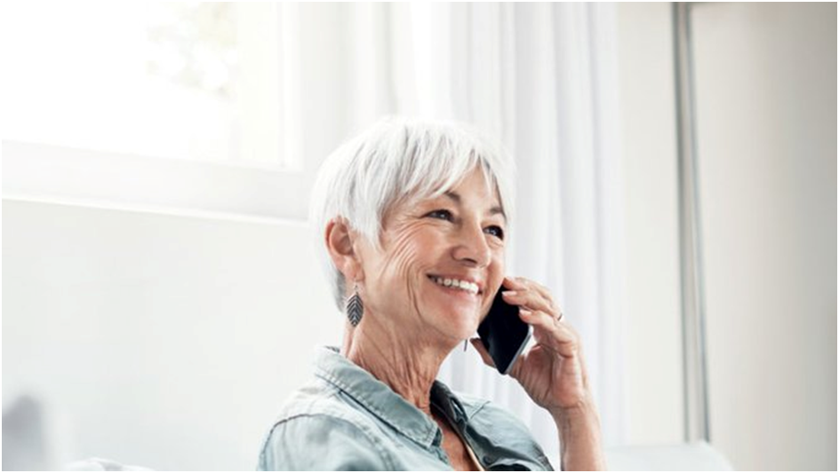 Older woman talks by phone