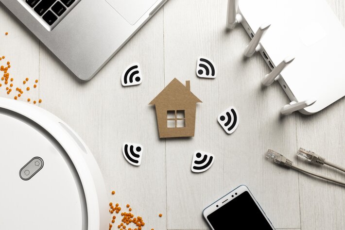 top view wi-fi router with house figurine wireless controlled