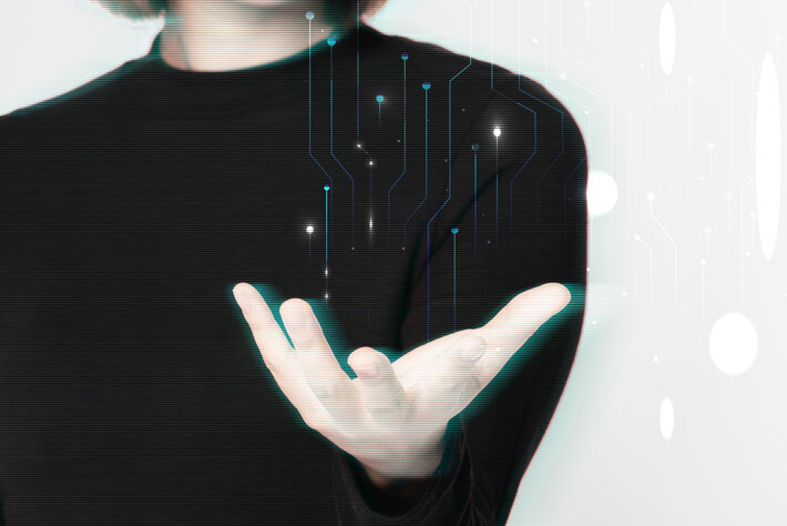 Glitching woman’s hand background using futuristic technology digital remix
